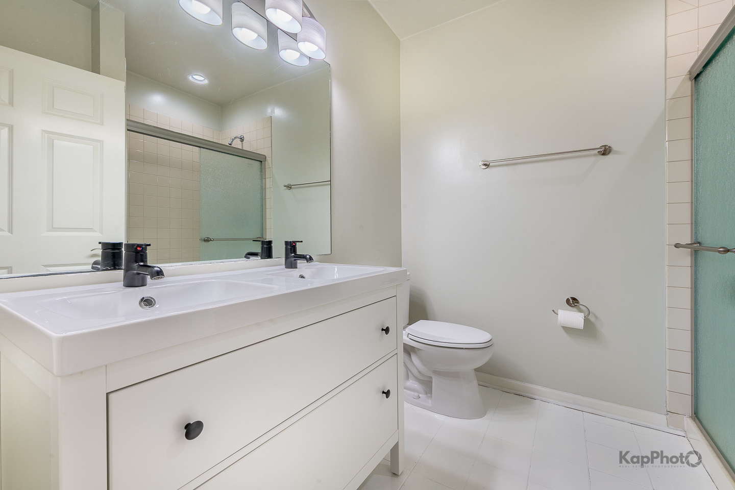 2142 West Madison Street, Unit 1 Chicago, IL 60612 - Photo 20 of 27 a bathroom with a sink toilet and a mirror
