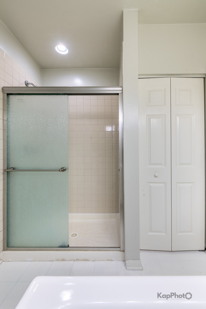 2142 West Madison Street, Unit 1 Chicago, IL 60612 - Photo 21 of 27 a bathroom with a shower