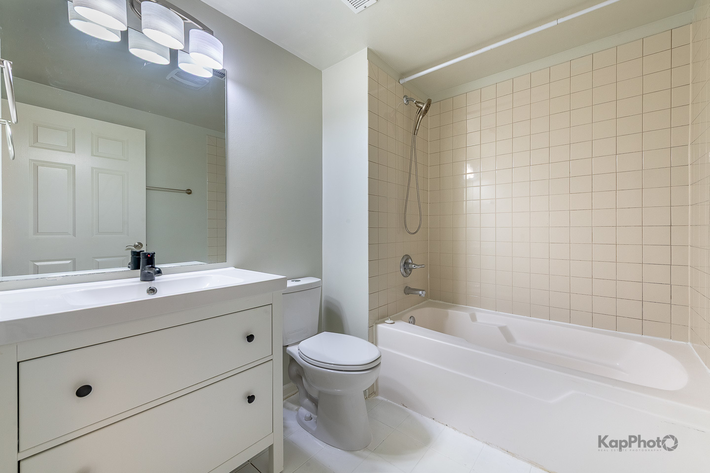 2142 West Madison Street, Unit 1 Chicago, IL 60612 - Photo 23 of 27 a bathroom with a bathtub a sink a toilet and a mirror