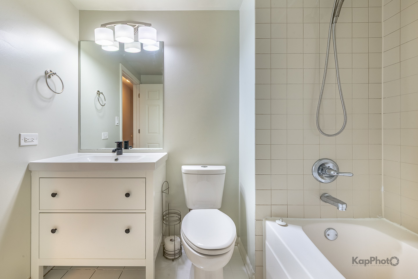 2142 West Madison Street, Unit 1 Chicago, IL 60612 - Photo 25 of 27 a bathroom with a sink a toilet and shower