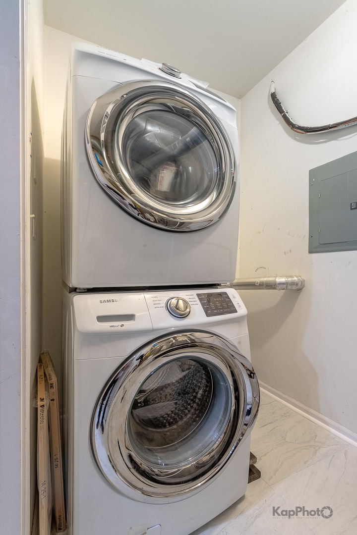 2142 West Madison Street, Unit 1 Chicago, IL 60612 - Photo 26 of 27 a utility room with dryer and washer