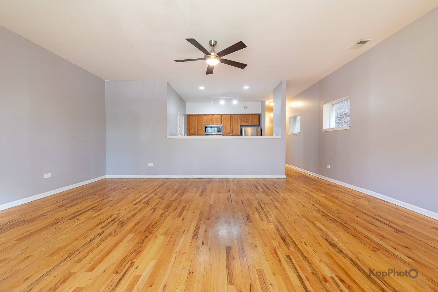 2142 West Madison Street, Unit 1 Chicago, IL 60612 - Photo 5 of 27 wooden floor in an empty room with a window