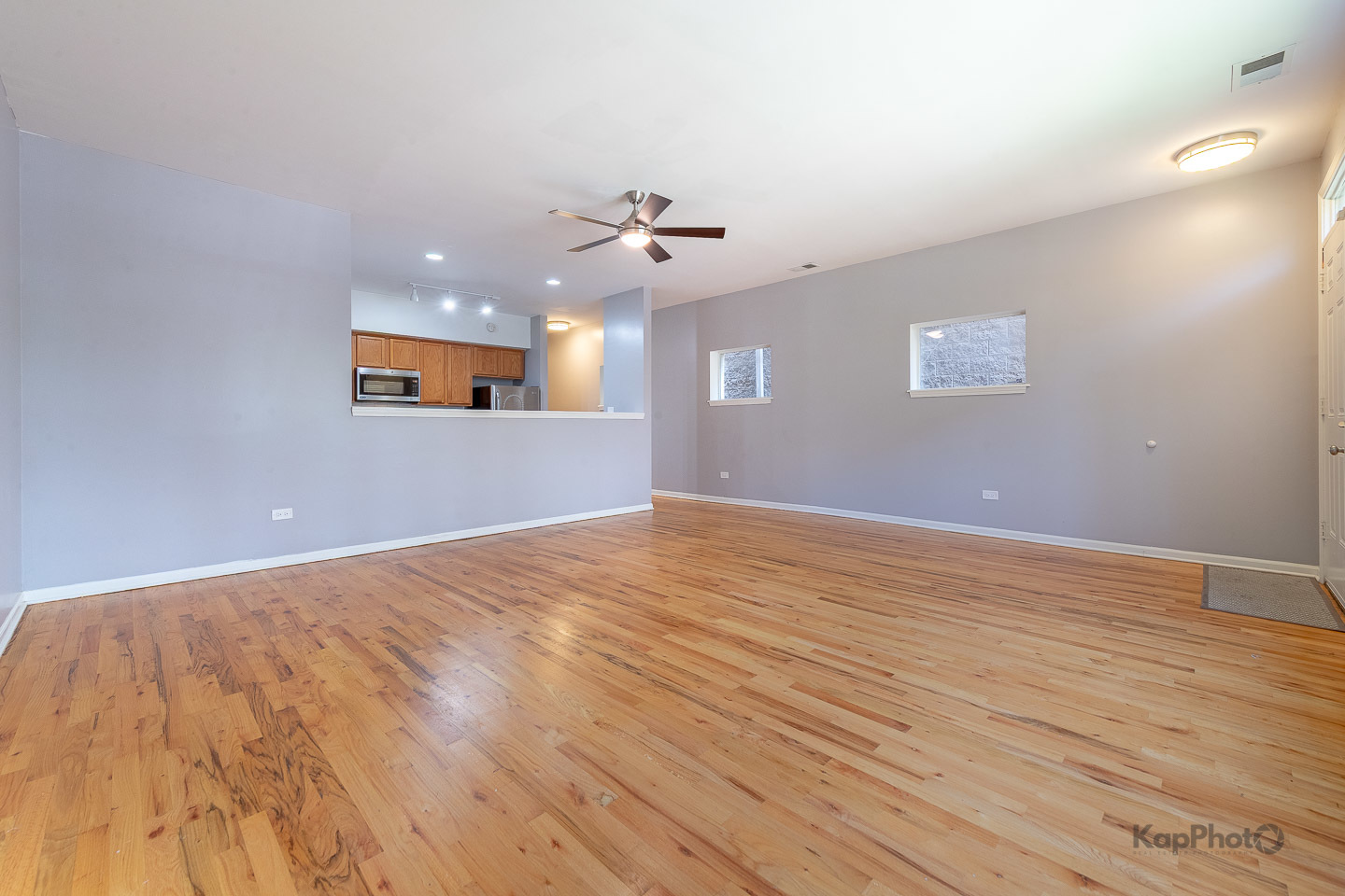 2142 West Madison Street, Unit 1 Chicago, IL 60612 - Photo 6 of 27 wooden floor in an empty room with a window
