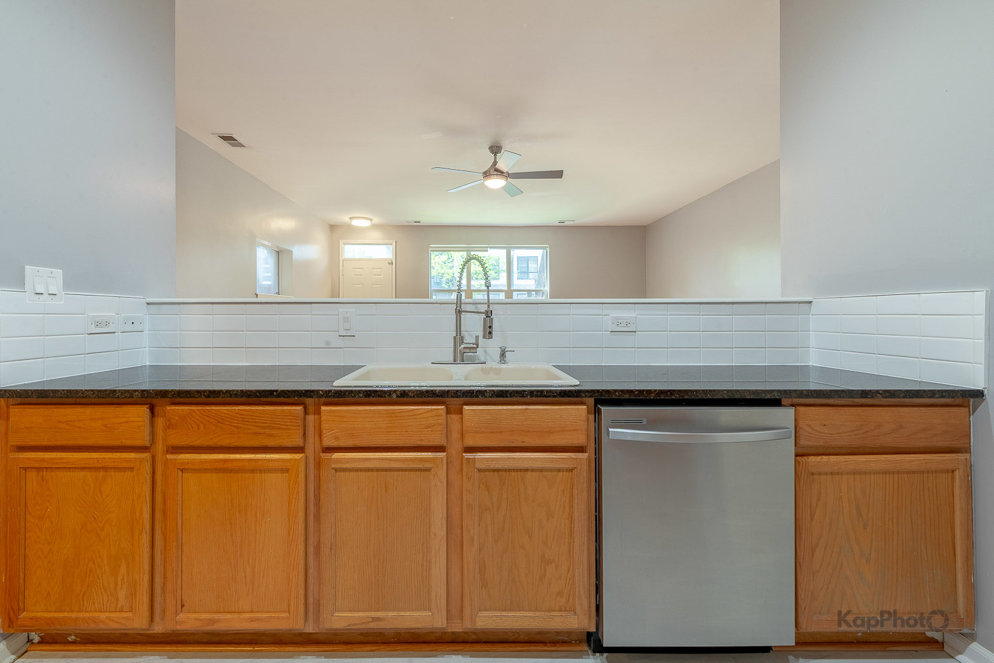 2142 West Madison Street, Unit 1 Chicago, IL 60612 - Photo 10 of 27 a kitchen with granite countertop cabinets stainless steel appliances and a counter space