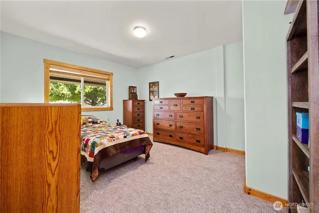 a bedroom with a bed and a closet