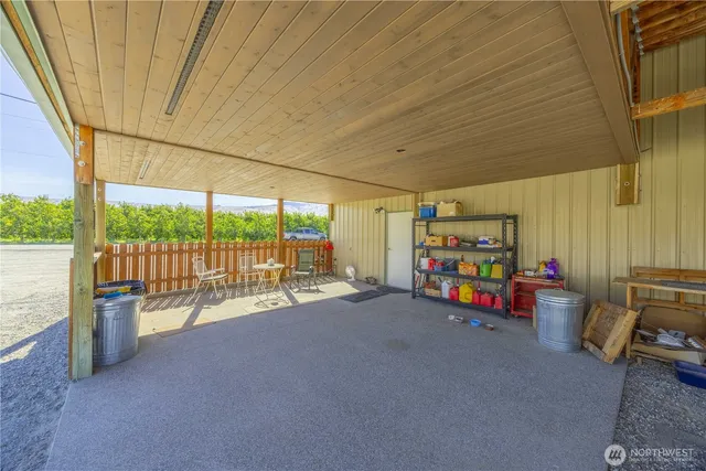 a view of a garage with a table and chairs