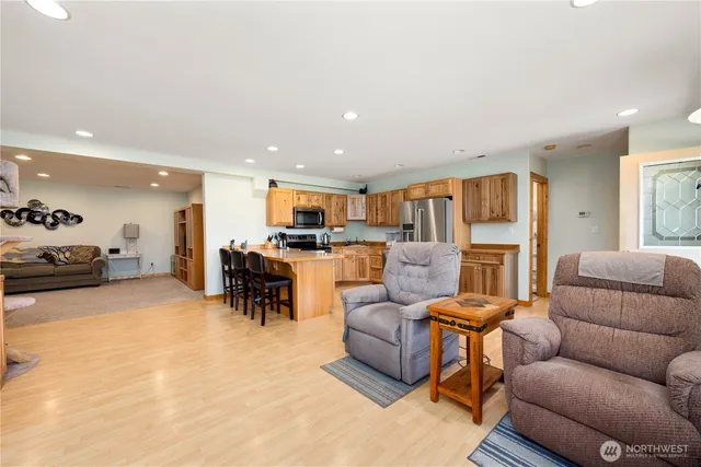 a living room with furniture kitchen and a kitchen view