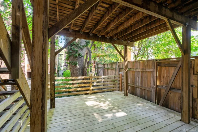 a view of outdoor space with wooden floor