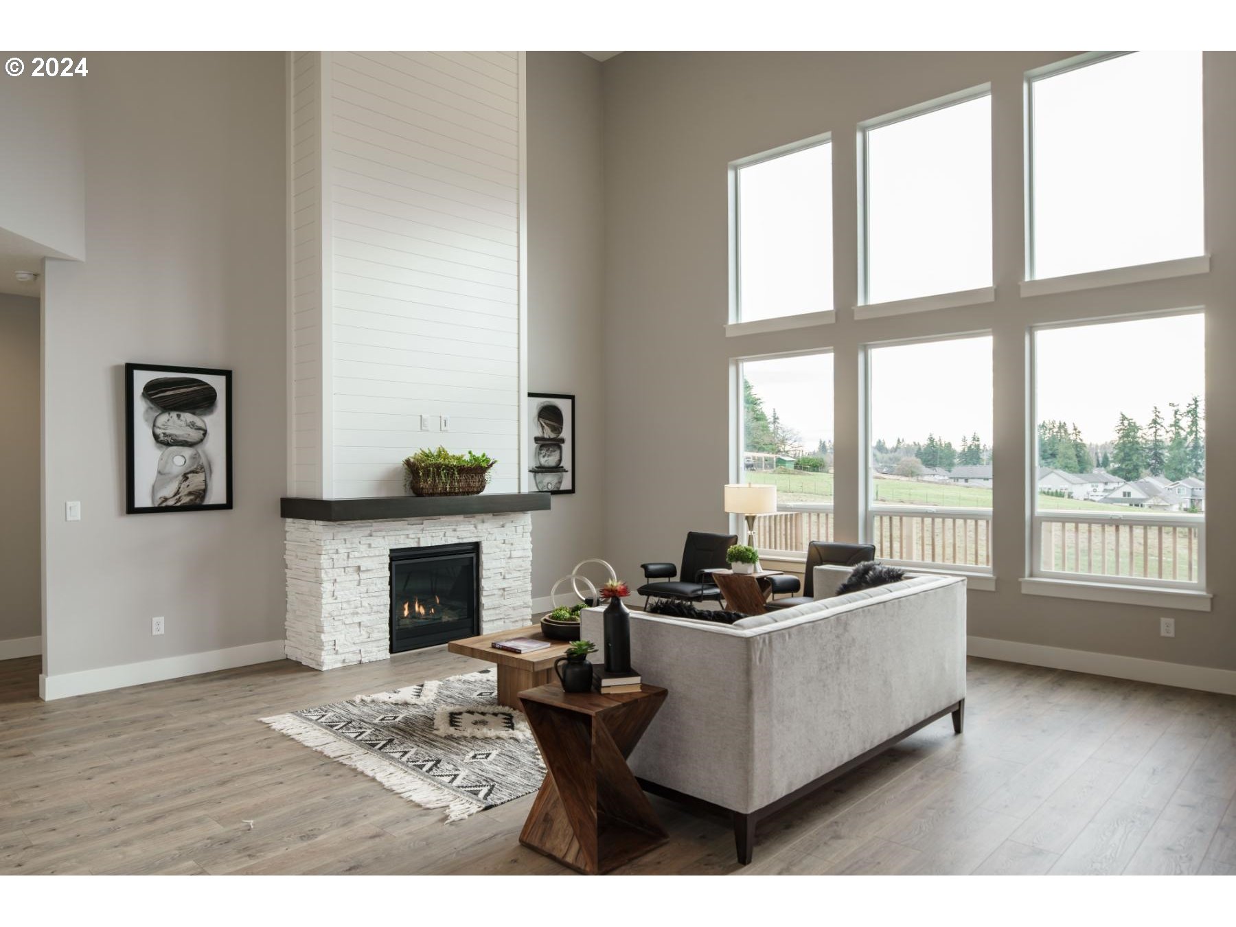 4219 North 11th Way Ridgefield, WA 98642 - Photo 5 of 32 a living room with furniture large window and a fireplace