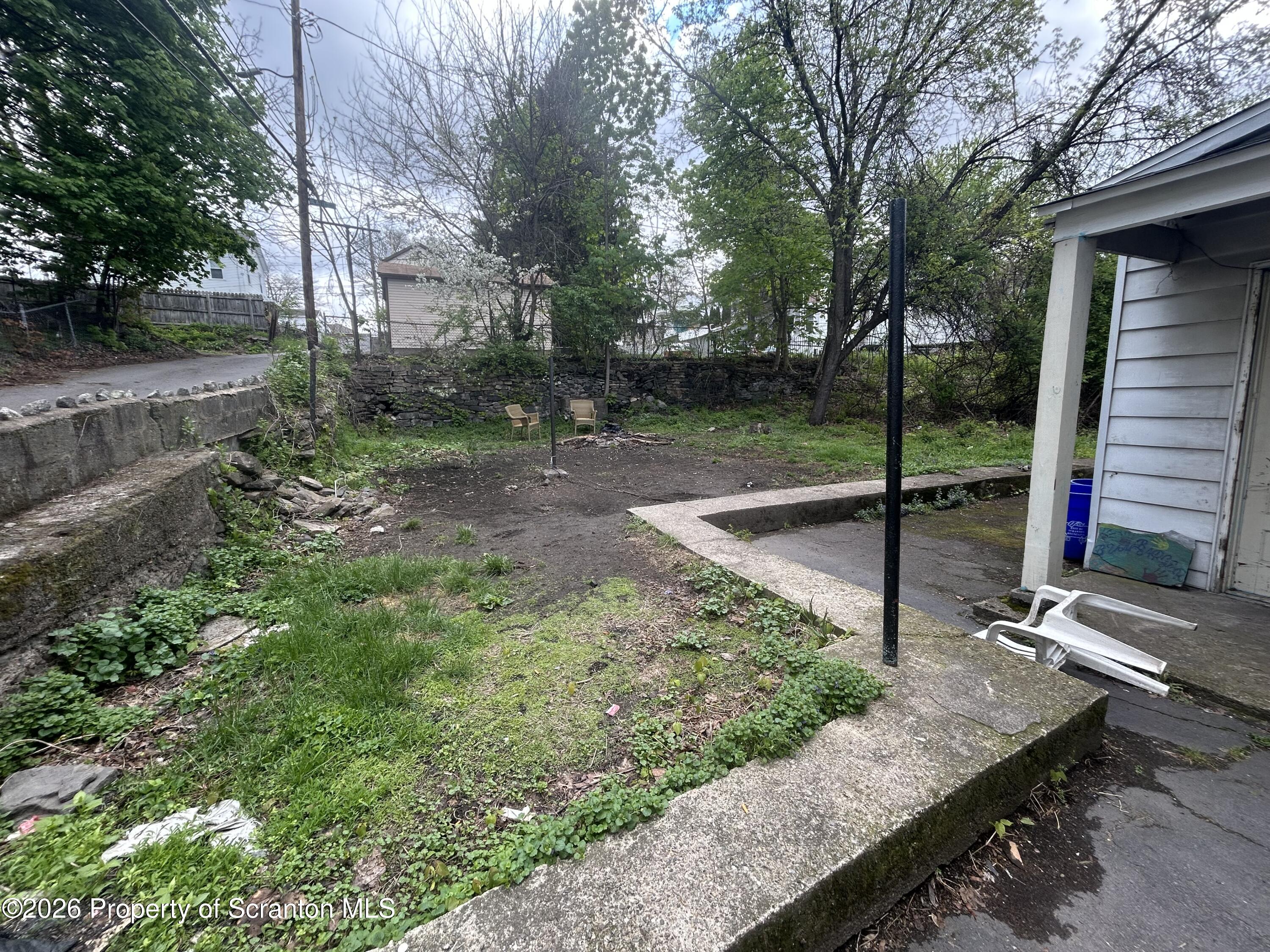 717 East Elm Street, Unit REAR Scranton, PA 18505 - Photo 4 of 9 a view of a backyard with tree