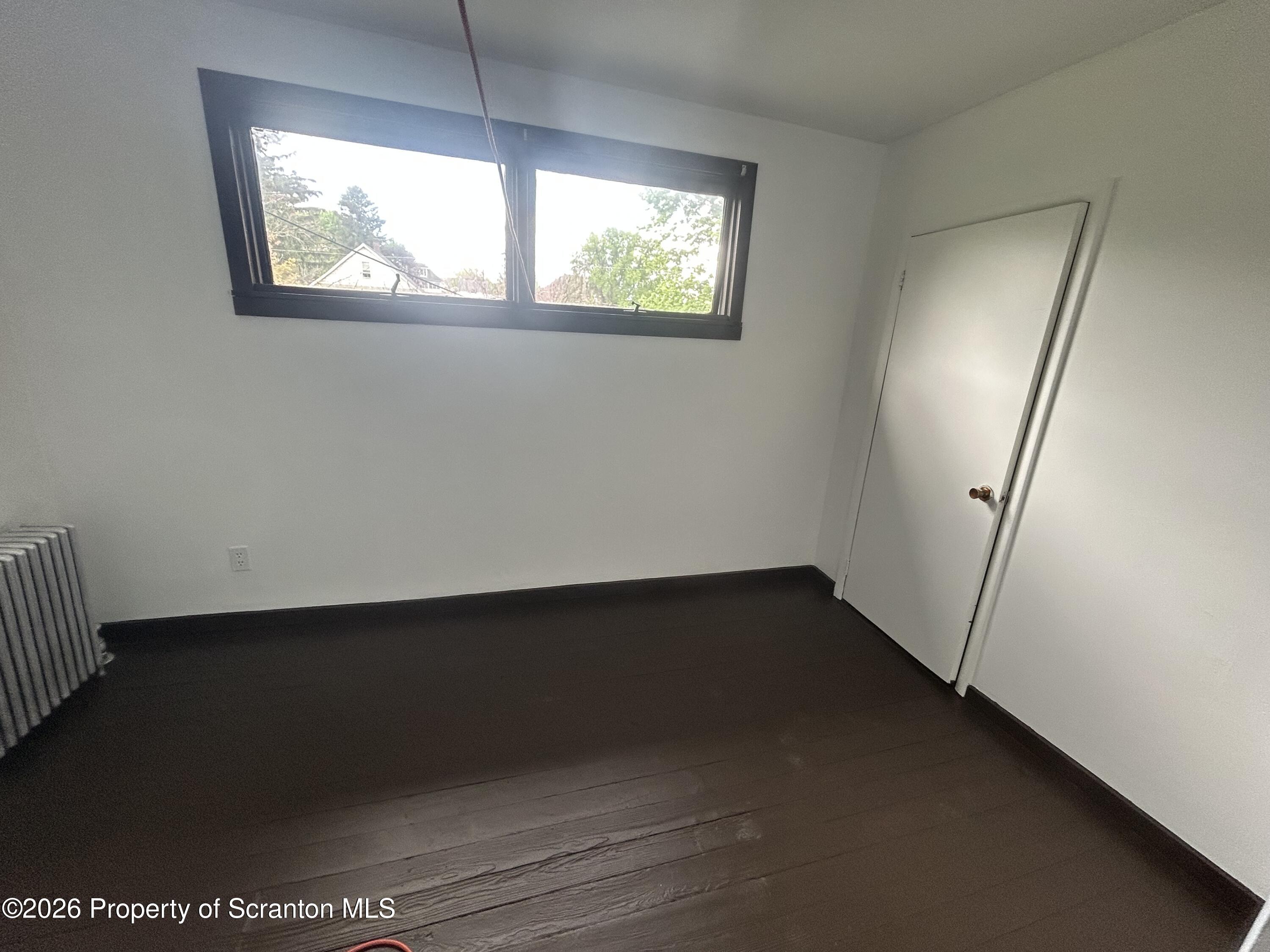 717 East Elm Street, Unit REAR Scranton, PA 18505 - Photo 6 of 9 an empty room with windows