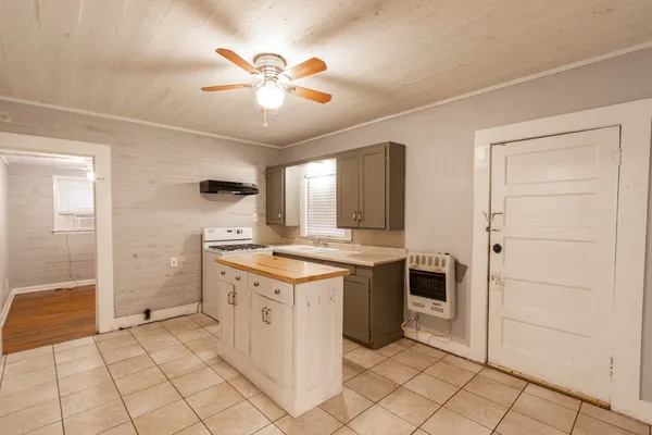 a kitchen with a stove and a refrigerator