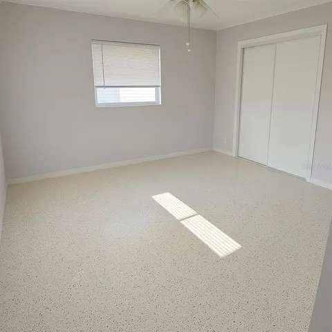 an empty room with a empty space and window