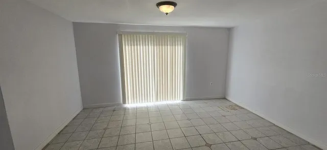 a view of an empty room and window