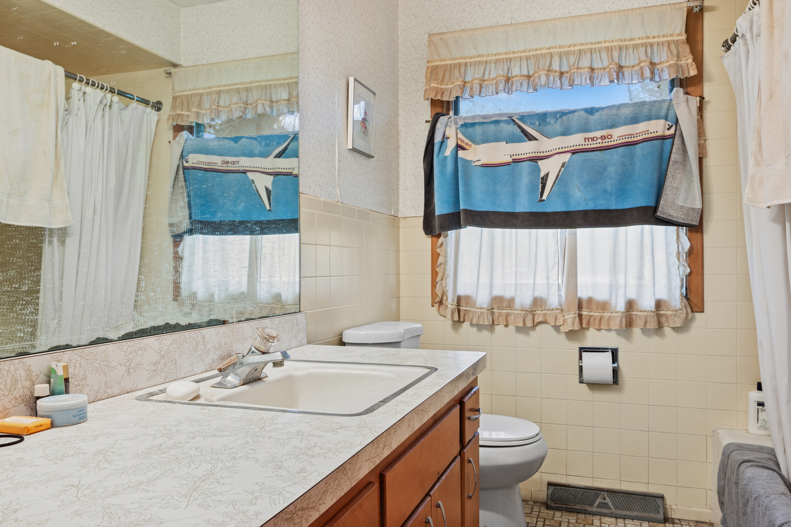 23520 North Old McHenry Road Lake Zurich, IL 60047 - Photo 11 of 21 a bathroom with a sink and a mirror
