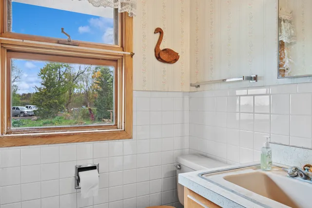 a bathroom with a sink and a window