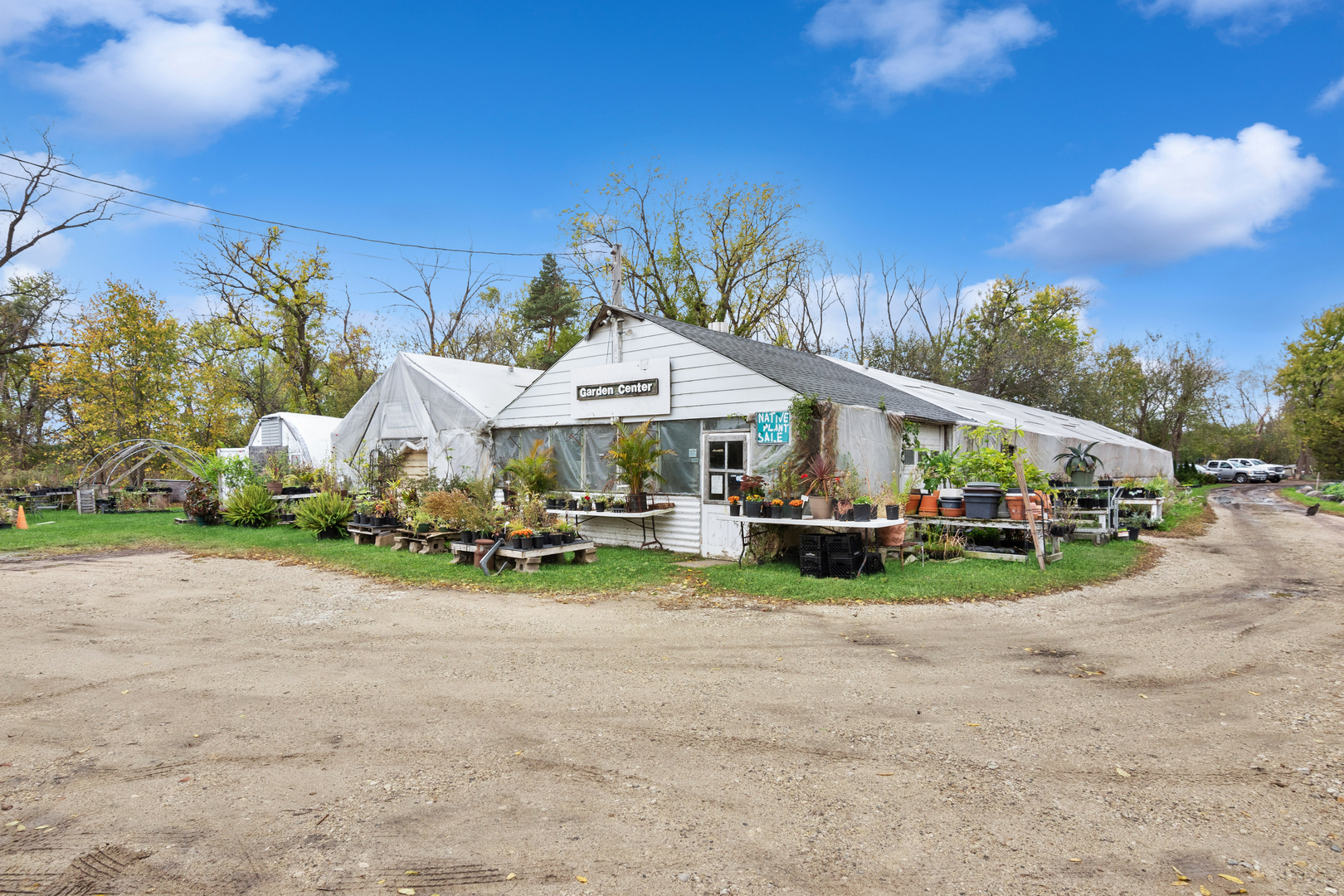 23520 North Old McHenry Road Lake Zurich, IL 60047 - Photo 2 of 21 a wooden bench sitting in front of a house with wooden fence