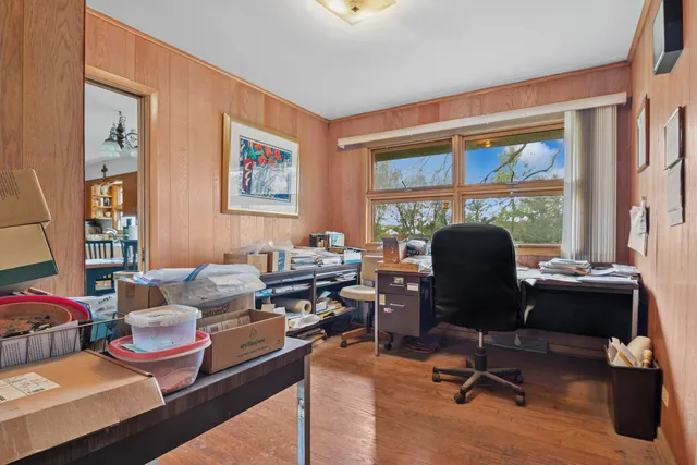 a living room with furniture a rug and a large window