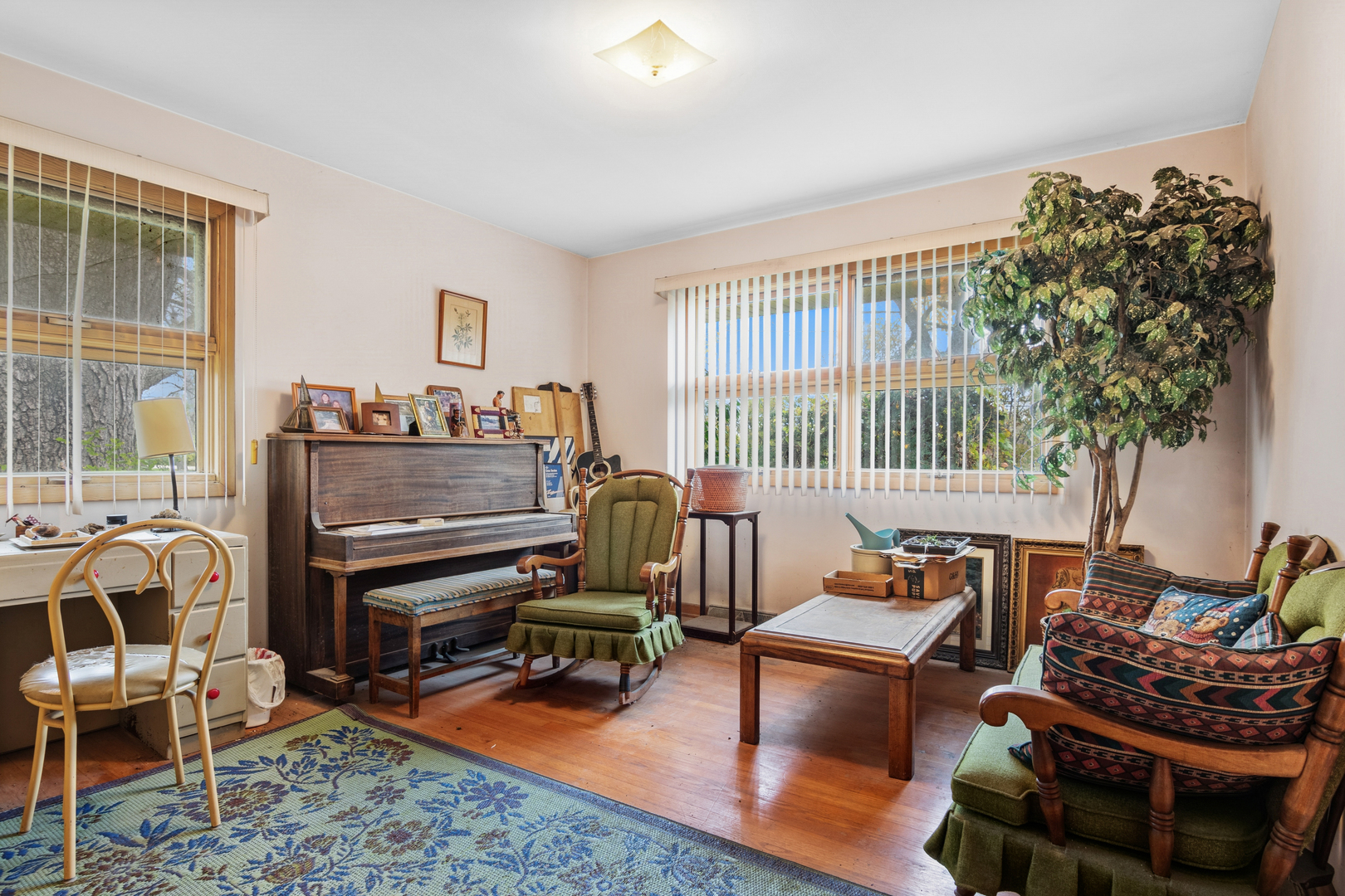 23520 North Old McHenry Road Lake Zurich, IL 60047 - Photo 10 of 21 a living room with furniture a piano and a potted plant