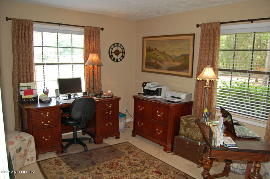 6675 Brooklyn Bay Road Keystone Heights, FL 32656 - Photo 14 of 16 a view of a workspace with furniture and a window