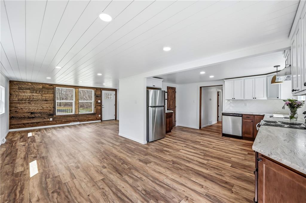 311 Oakdale Road Darlington, PA 16115 - Photo 16 of 32 a view of a kitchen with a sink and a refrigerator