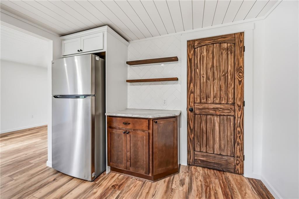 311 Oakdale Road Darlington, PA 16115 - Photo 21 of 32 a view of kitchen with stainless steel appliances wooden floor