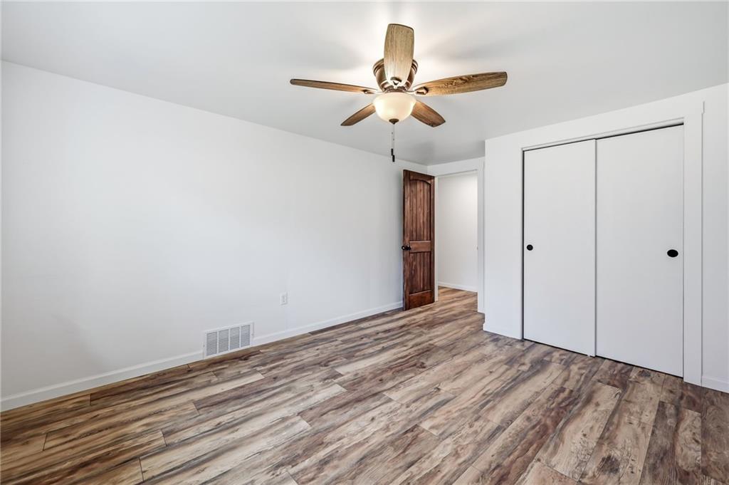 311 Oakdale Road Darlington, PA 16115 - Photo 22 of 32 a view of an empty room with wooden floor