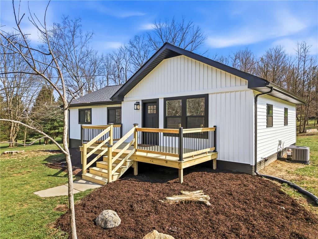 311 Oakdale Road Darlington, PA 16115 - Photo 3 of 32 a house with trees in front of it