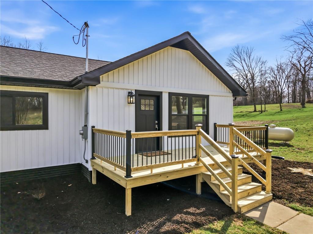 311 Oakdale Road Darlington, PA 16115 - Photo 5 of 32 a view of a house with a bed and wooden floor