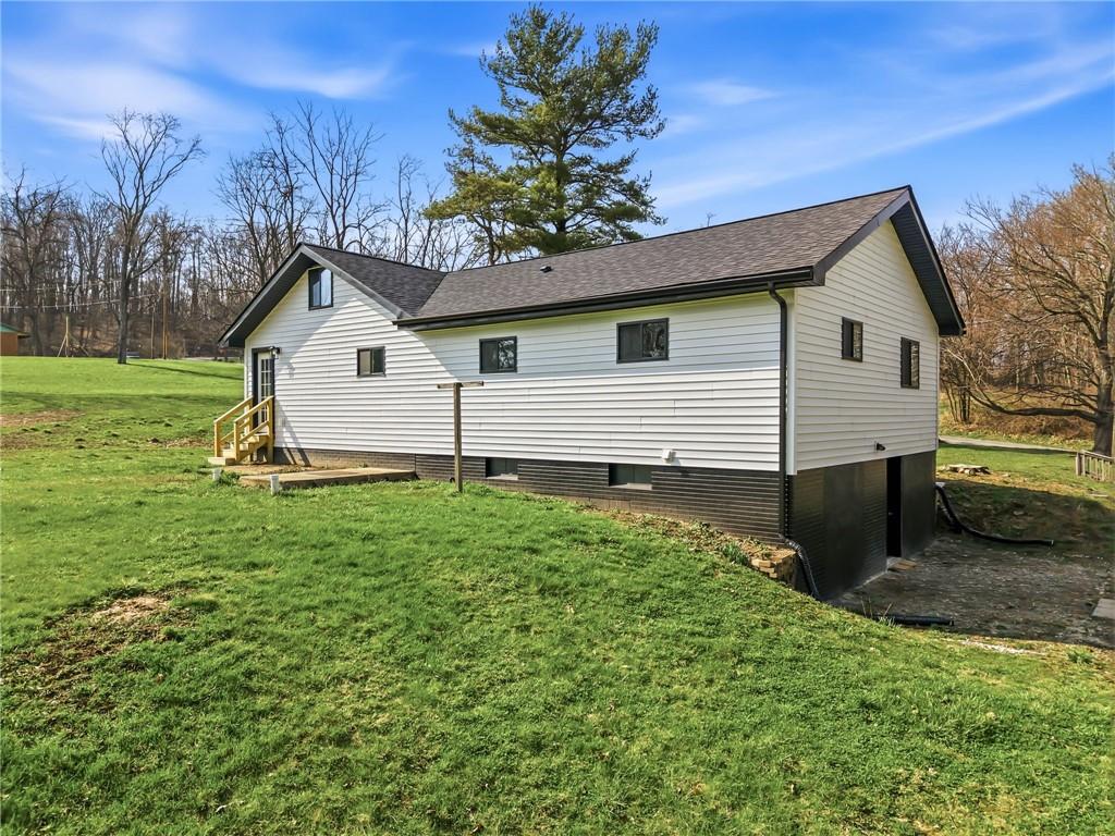 311 Oakdale Road Darlington, PA 16115 - Photo 8 of 32 a front view of a house with a yard