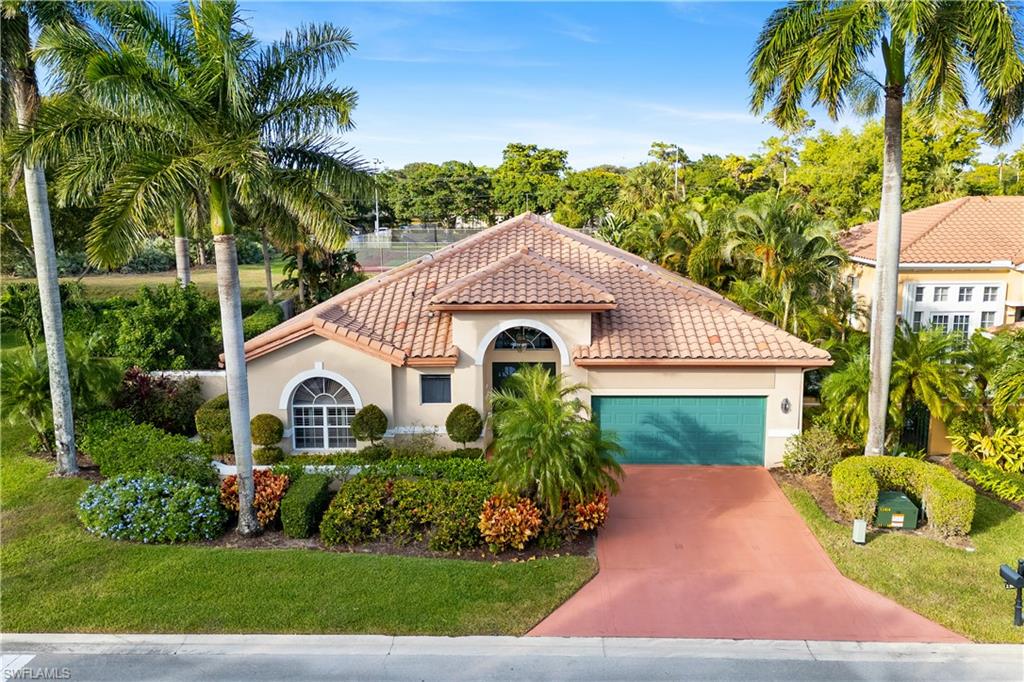 Mediterranean style home with a garage