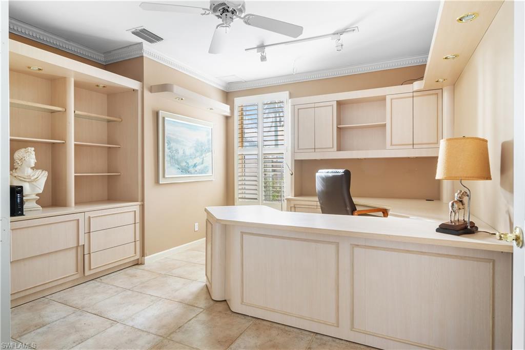 2399 Northwest 24th Street Boca Raton, FL 33434 - Photo 13 of 23 Office space with light tile patterned floors, track lighting, ceiling fan, and ornamental molding