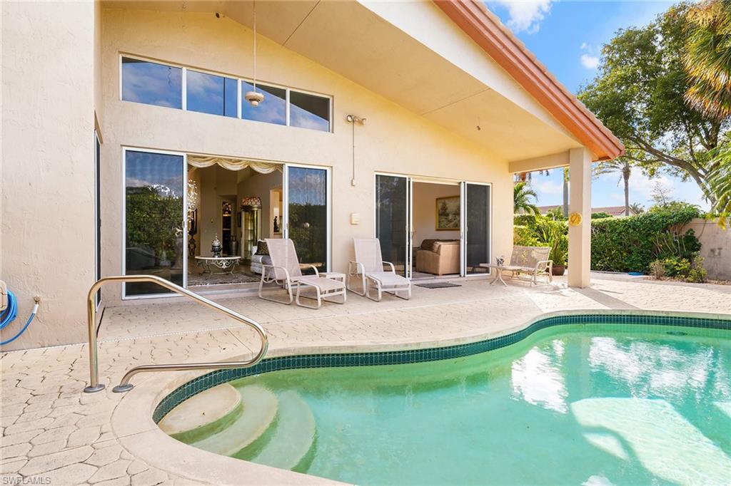 2399 Northwest 24th Street Boca Raton, FL 33434 - Photo 19 of 23 View of swimming pool featuring a patio