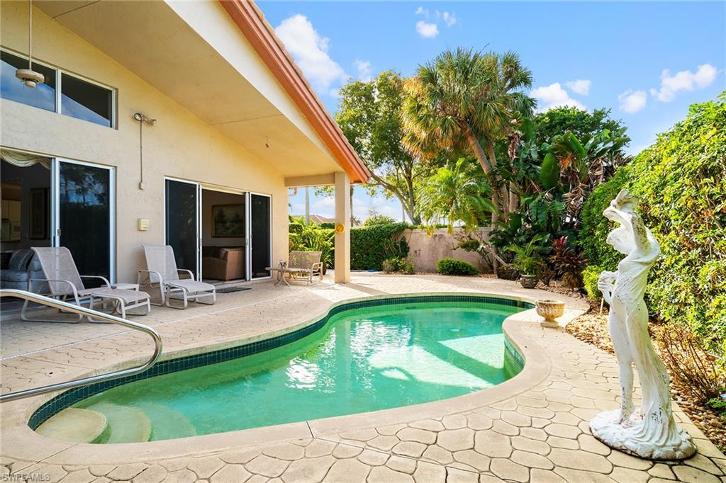2399 Northwest 24th Street Boca Raton, FL 33434 - Photo 20 of 23 View of swimming pool with a patio area