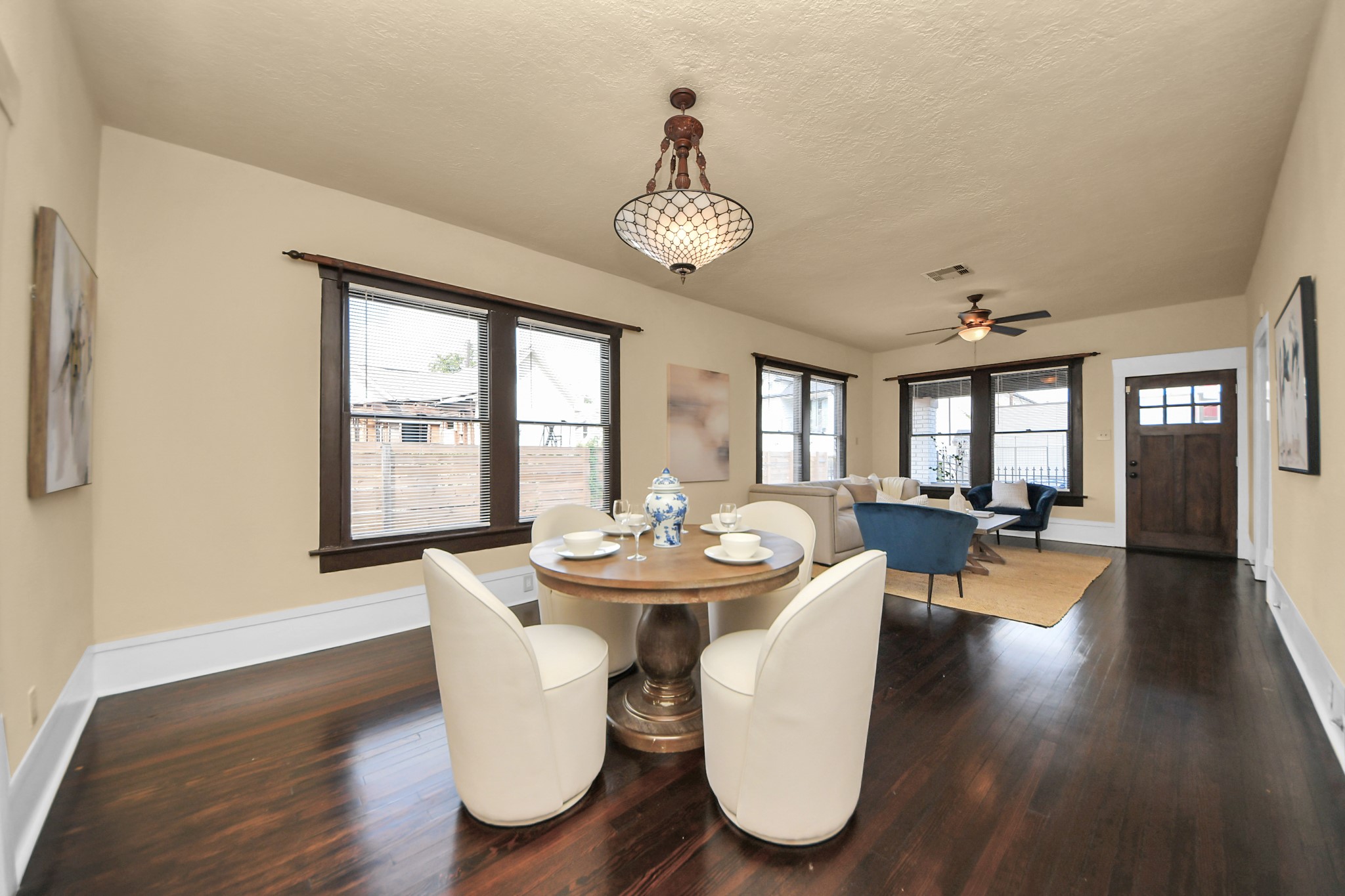 1211 Bingham Street Houston, TX 77007 - Photo 16 of 48 a view of a dining room with furniture wooden floor and chandelier