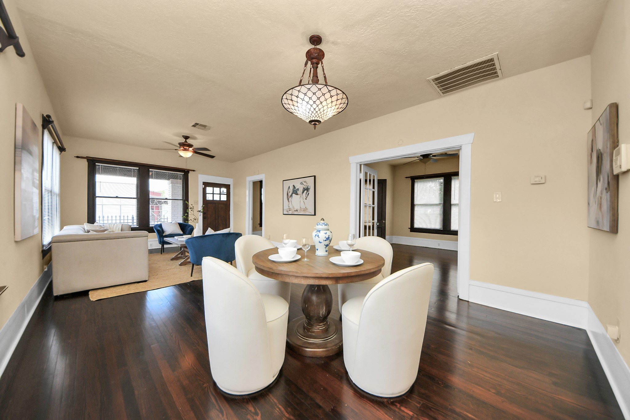 1211 Bingham Street Houston, TX 77007 - Photo 17 of 48 a view of a dining room with furniture wooden floor and chandelier