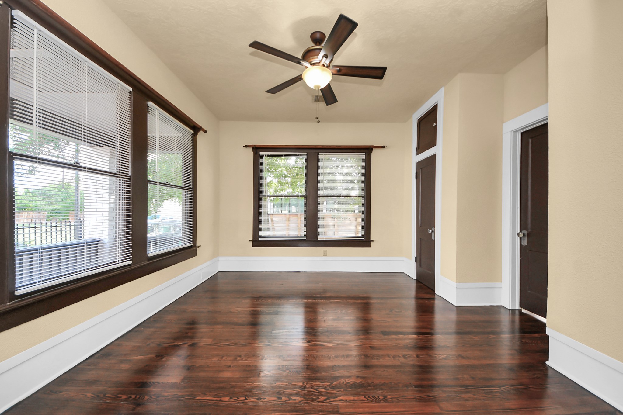 1211 Bingham Street Houston, TX 77007 - Photo 18 of 48 a view of an empty room with wooden floor and a window