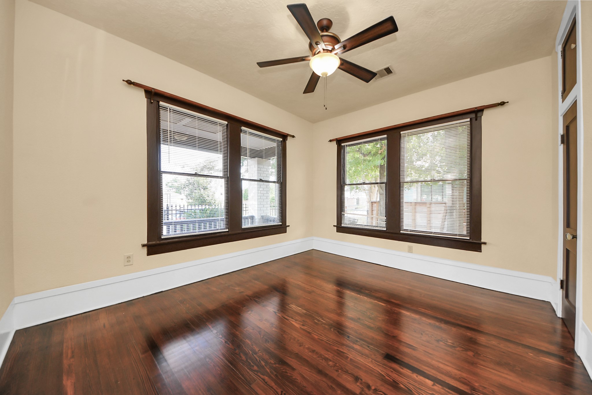 1211 Bingham Street Houston, TX 77007 - Photo 20 of 48 a view of an empty room with a window and wooden floor