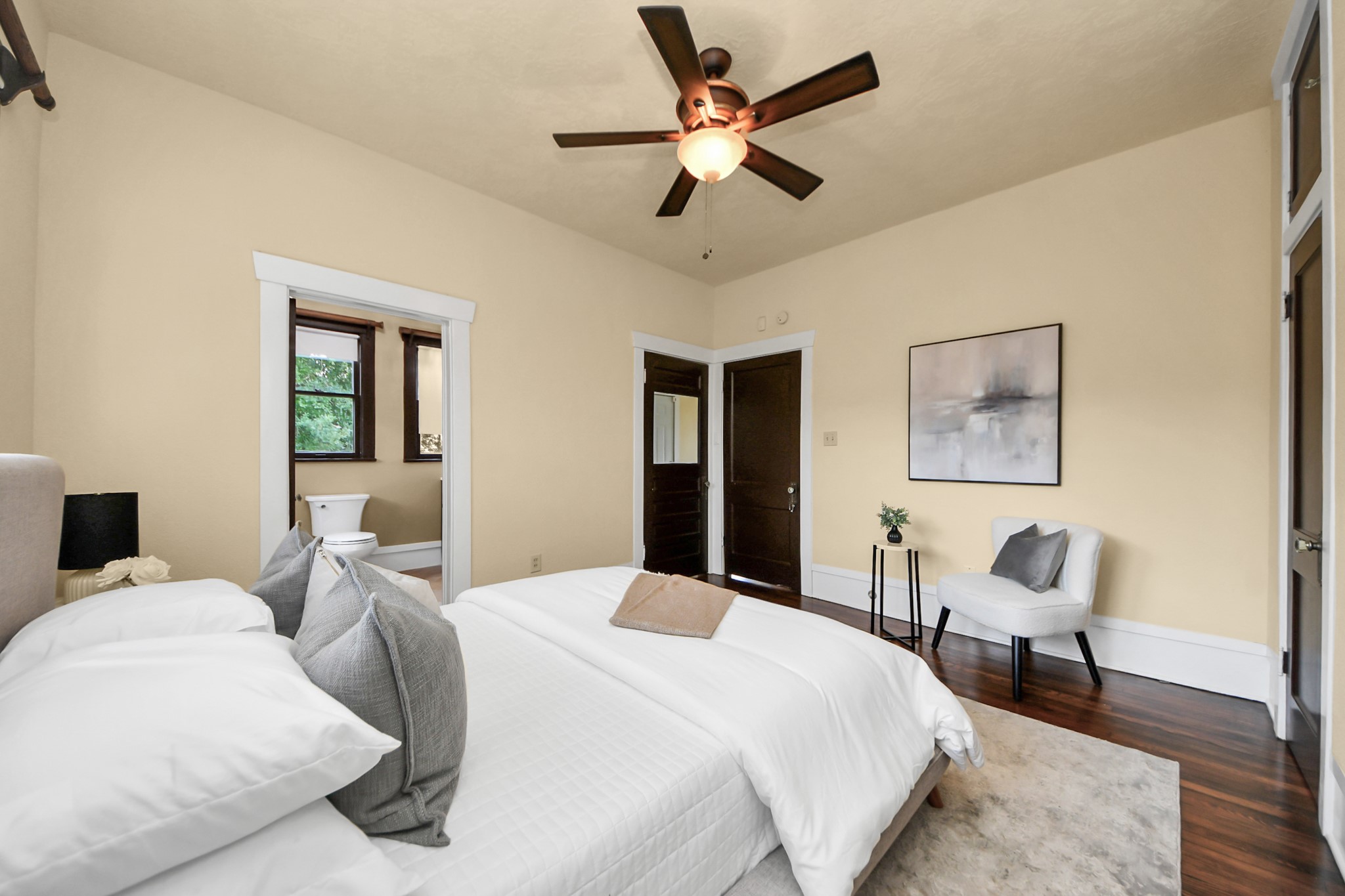 1211 Bingham Street Houston, TX 77007 - Photo 25 of 48 a bedroom with a bed and wooden floor