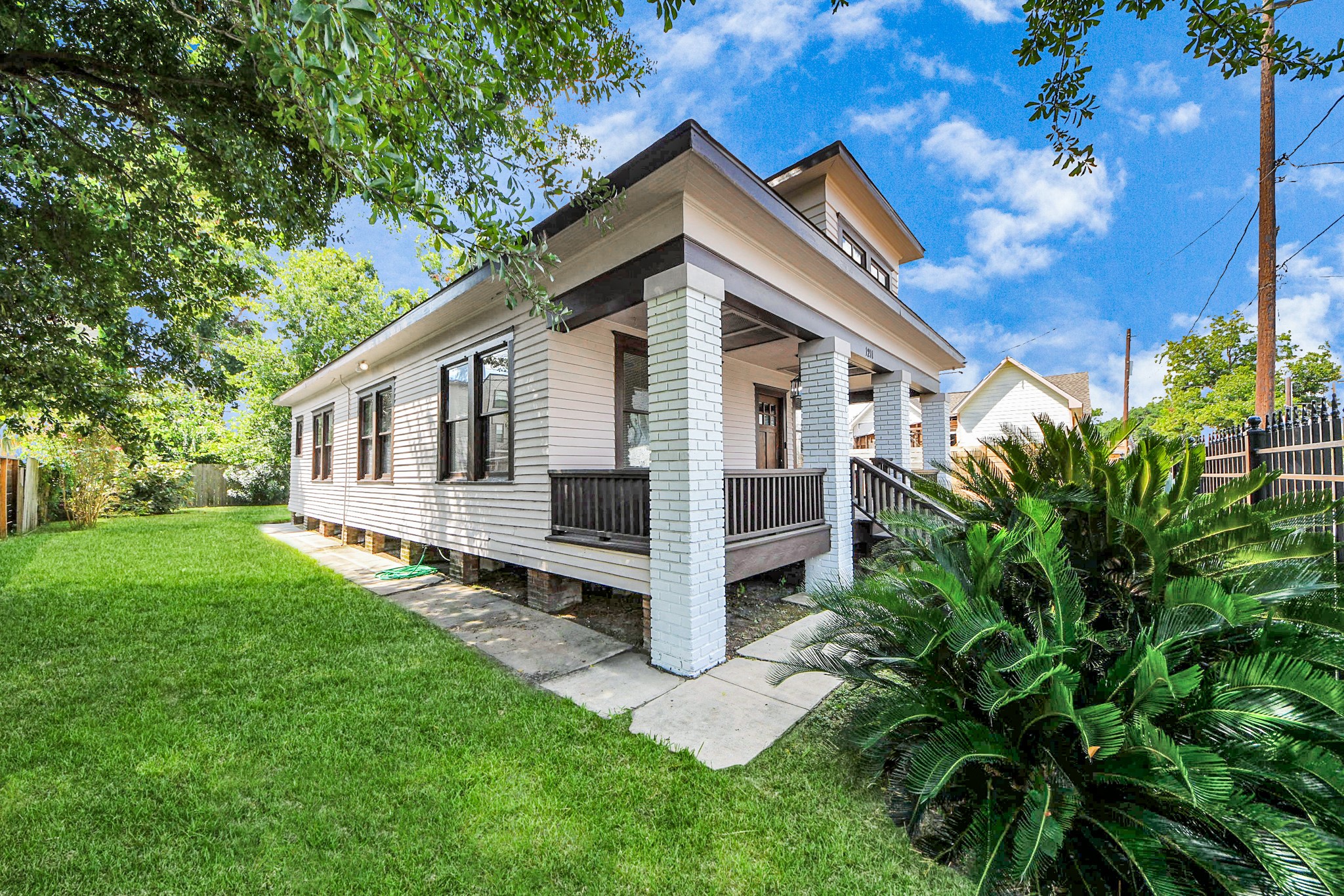 1211 Bingham Street Houston, TX 77007 - Photo 43 of 48 a view of a house with a yard plants and large tree