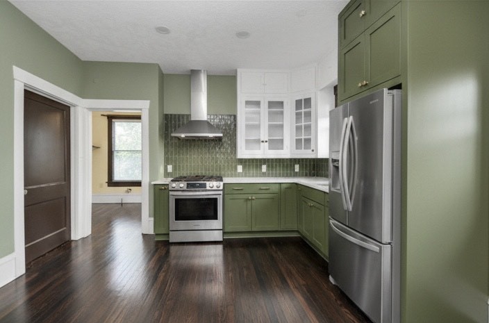 1211 Bingham Street Houston, TX 77007 - Photo 5 of 48 a kitchen with a refrigerator and a sink