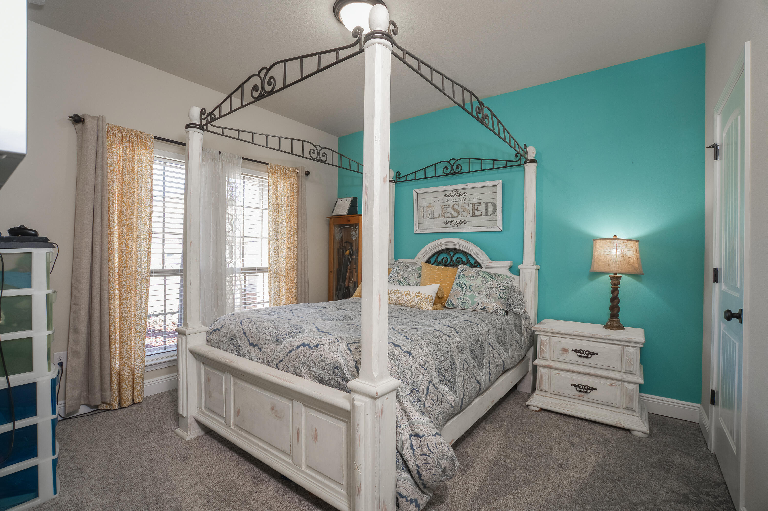 165 Pin Oak Loop Santa Rosa Beach, FL 32459 - Photo 32 of 41 a bed room with a bed and a chandelier