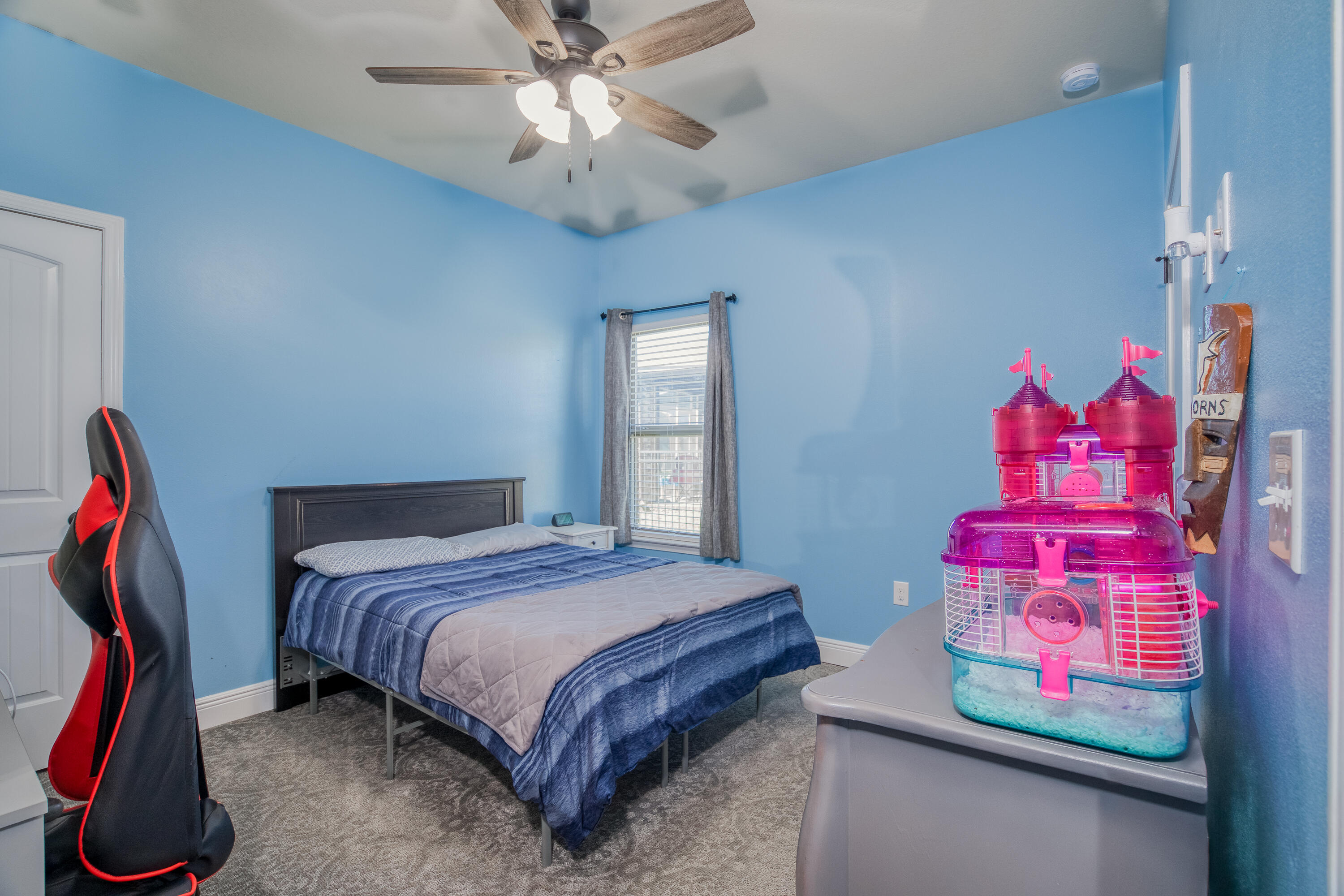 165 Pin Oak Loop Santa Rosa Beach, FL 32459 - Photo 34 of 41 a bedroom with a bed and chandelier