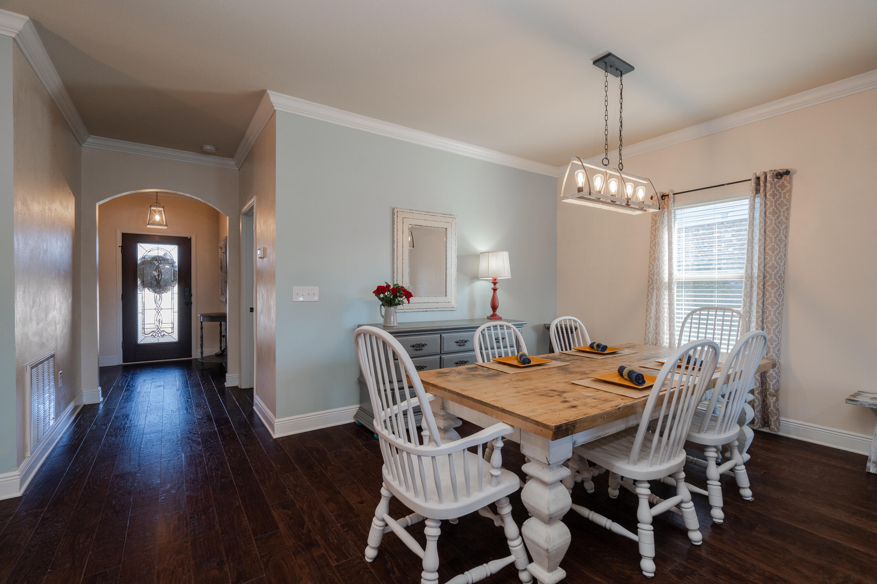 165 Pin Oak Loop Santa Rosa Beach, FL 32459 - Photo 8 of 41 a view of a dining room with furniture window and wooden floor