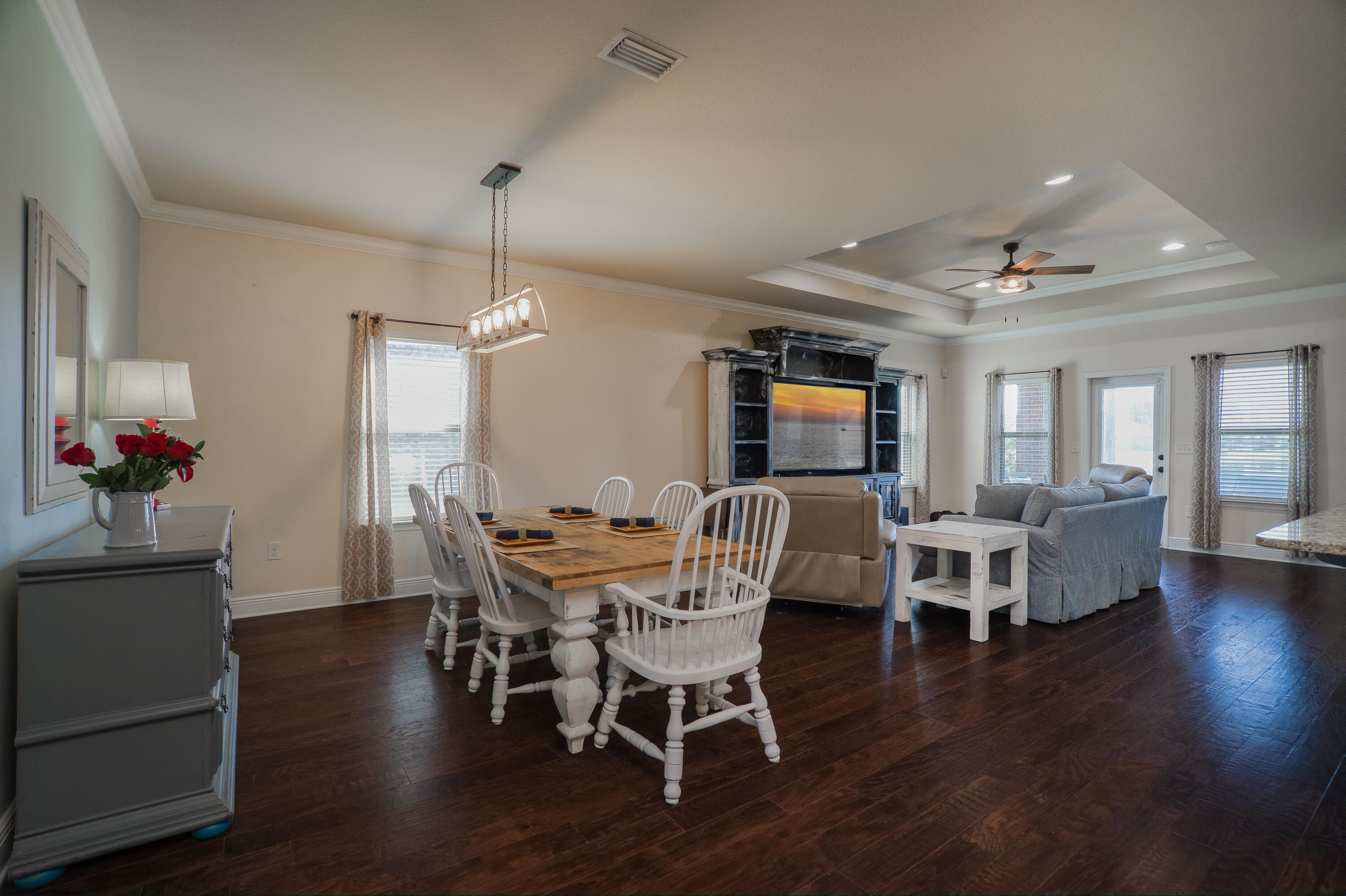 165 Pin Oak Loop Santa Rosa Beach, FL 32459 - Photo 9 of 41 a view of a dining room with furniture window and wooden floor