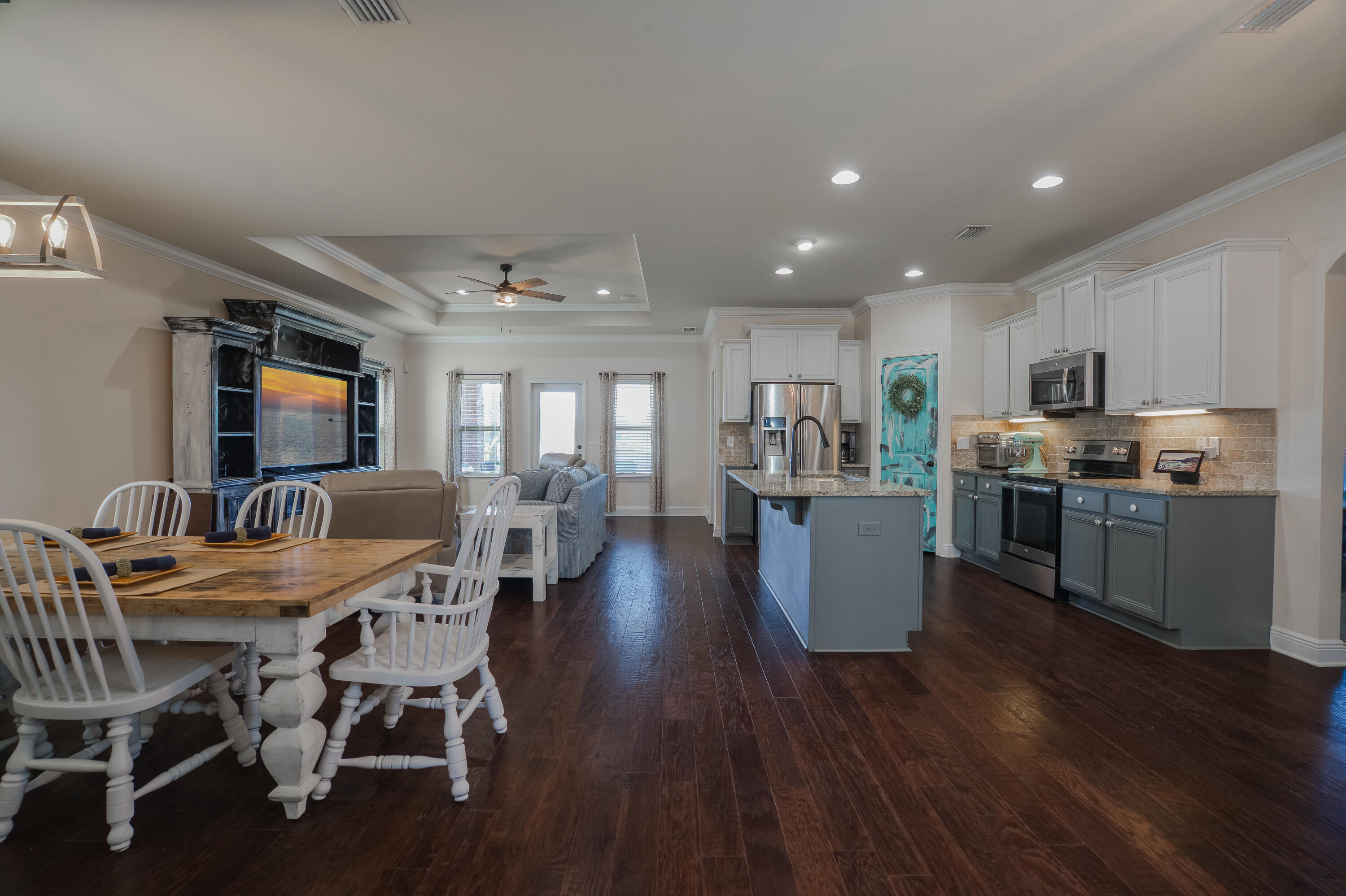 165 Pin Oak Loop Santa Rosa Beach, FL 32459 - Photo 10 of 41 a view of a dining room with furniture kitchen and wooden floor