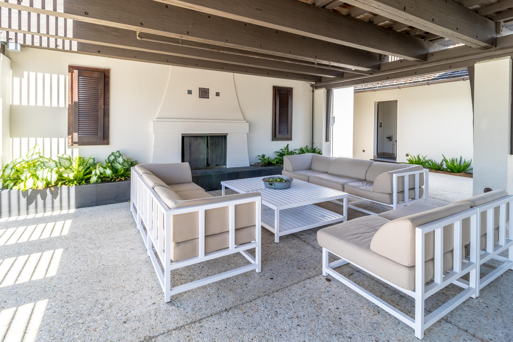 56 Cypress Drive Santa Rosa Beach, FL 32459 - Photo 56 of 61 a view of a patio with couches table and chairs and potted plants