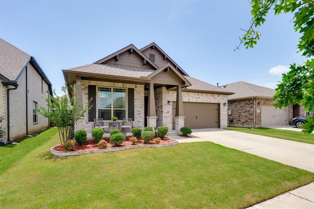 1320 Rosebush Road Aubrey, TX 76227 - Photo 2 of 33 a front view of a house with a garden and yard
