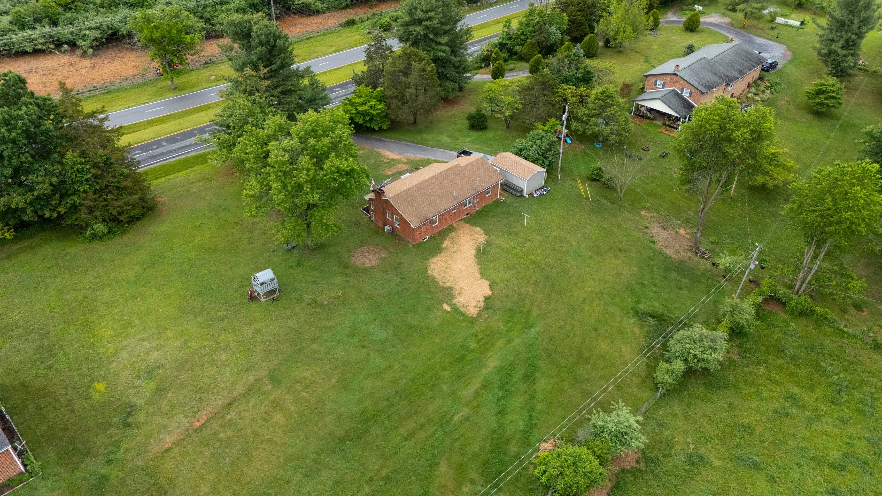 7827 Lee Highway Raphine, VA 24472 - Photo 55 of 62 a backyard of a house with a yard and outdoor seating