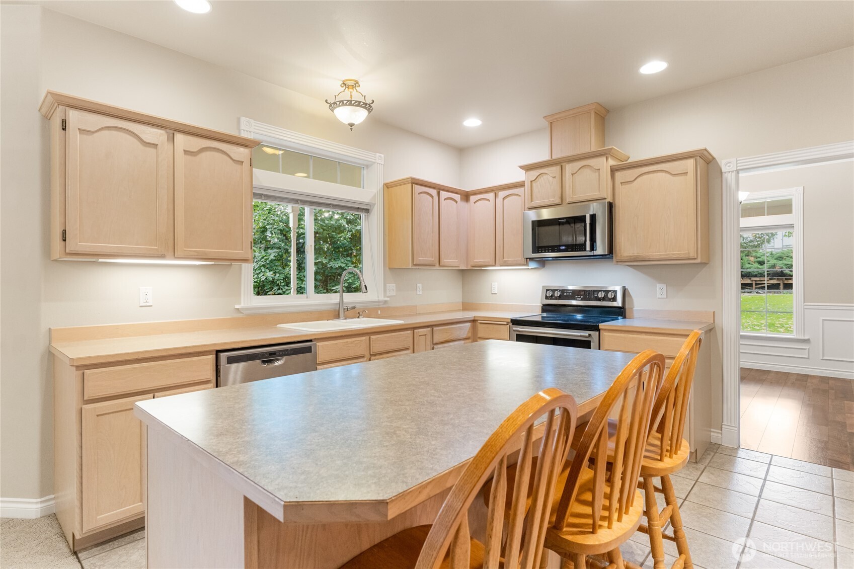 6005 Sunset Highway Cashmere, WA 98815 - Photo 13 of 40 a kitchen with stainless steel appliances granite countertop a sink a stove and a microwave